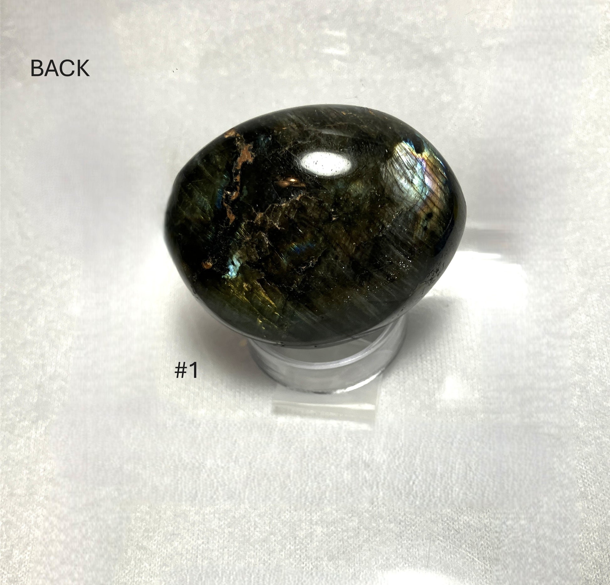 Labradorite stone on a stand labeled Back and #1 on a white background