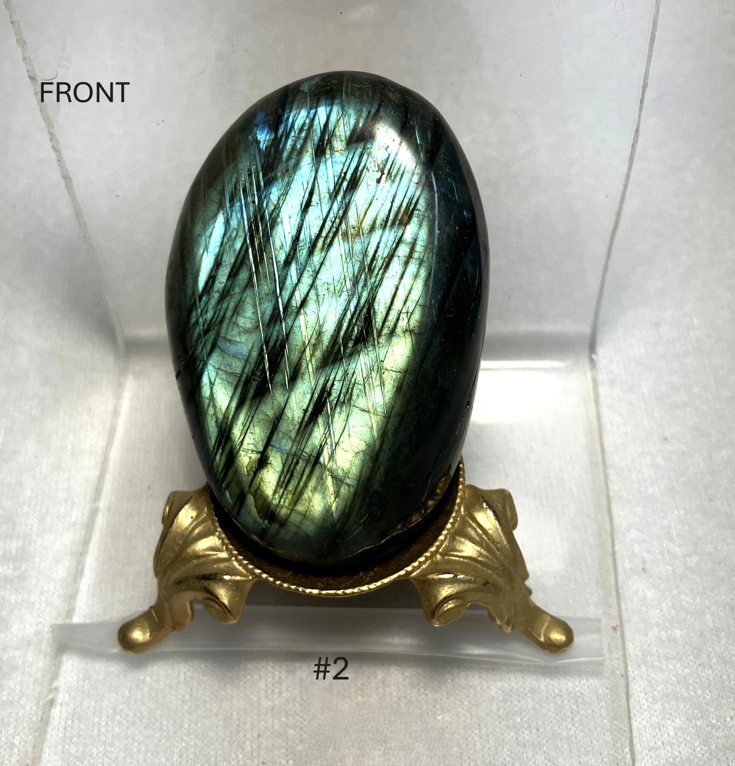Labradorite stone on a decorative stand with 'FRONT' label Stone number 2