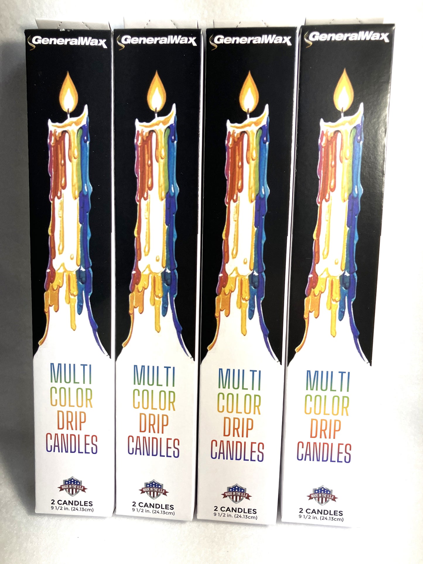 Four packages of Multi Color Drip Candles on a white background