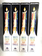 Four packages of Multi Color Drip Candles on a white background