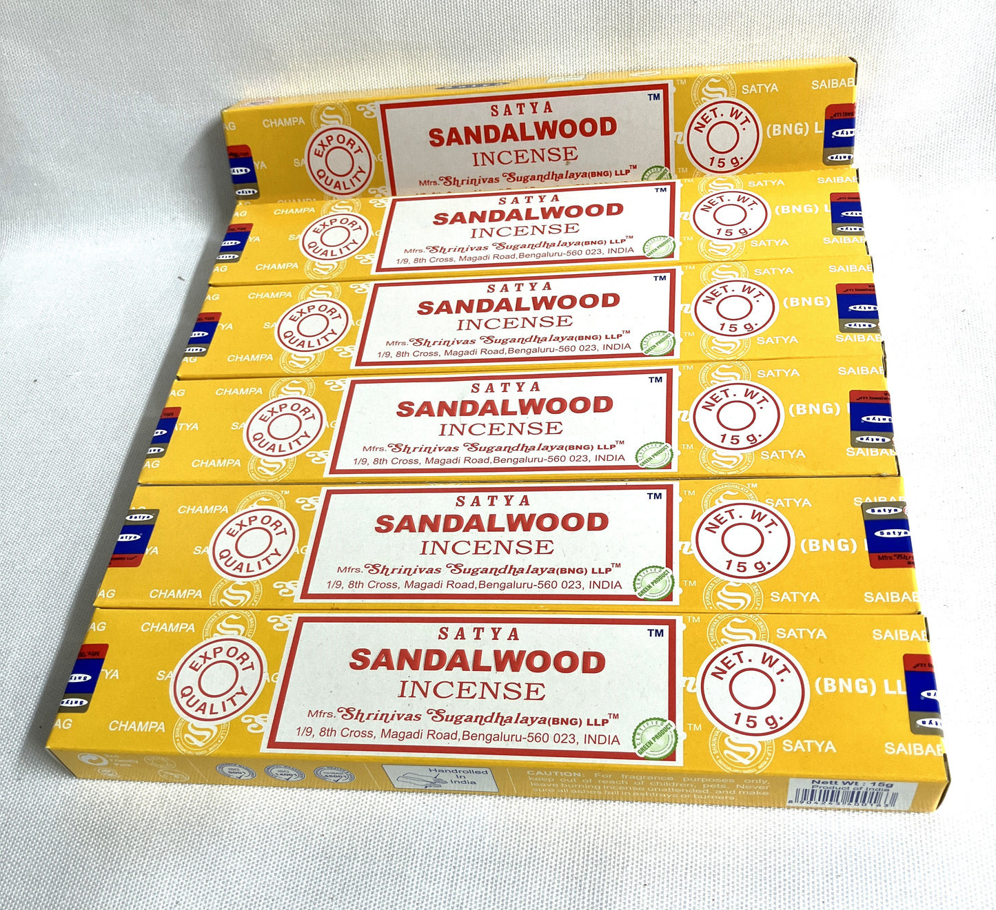 Stack of Satya Sandalwood Incense boxes on a white background