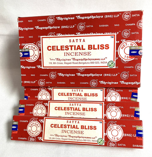 Multiple boxes of Satya Celestial Bliss Incense stacked on a white background