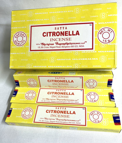 Yellow boxes of Satya Citronella Incense on a white background