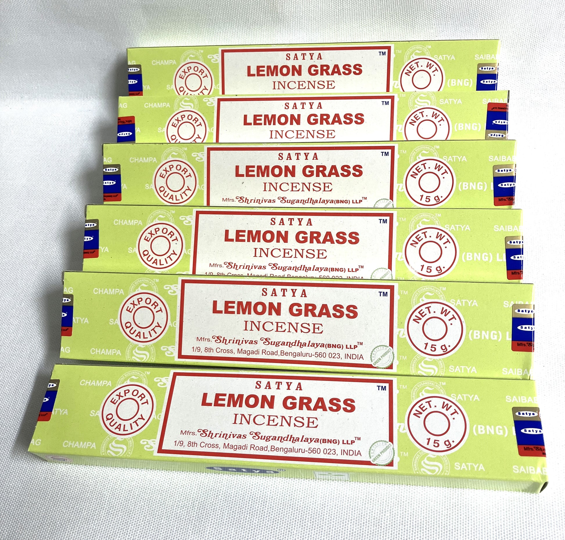 Multiple boxes of Satya Lemon Grass Incense on a light gray background