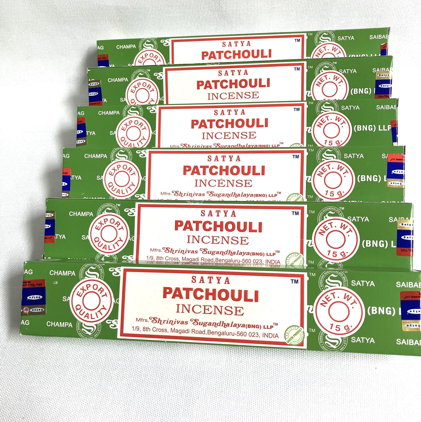 Multiple packages of Satya Patchouli Incense on a white background