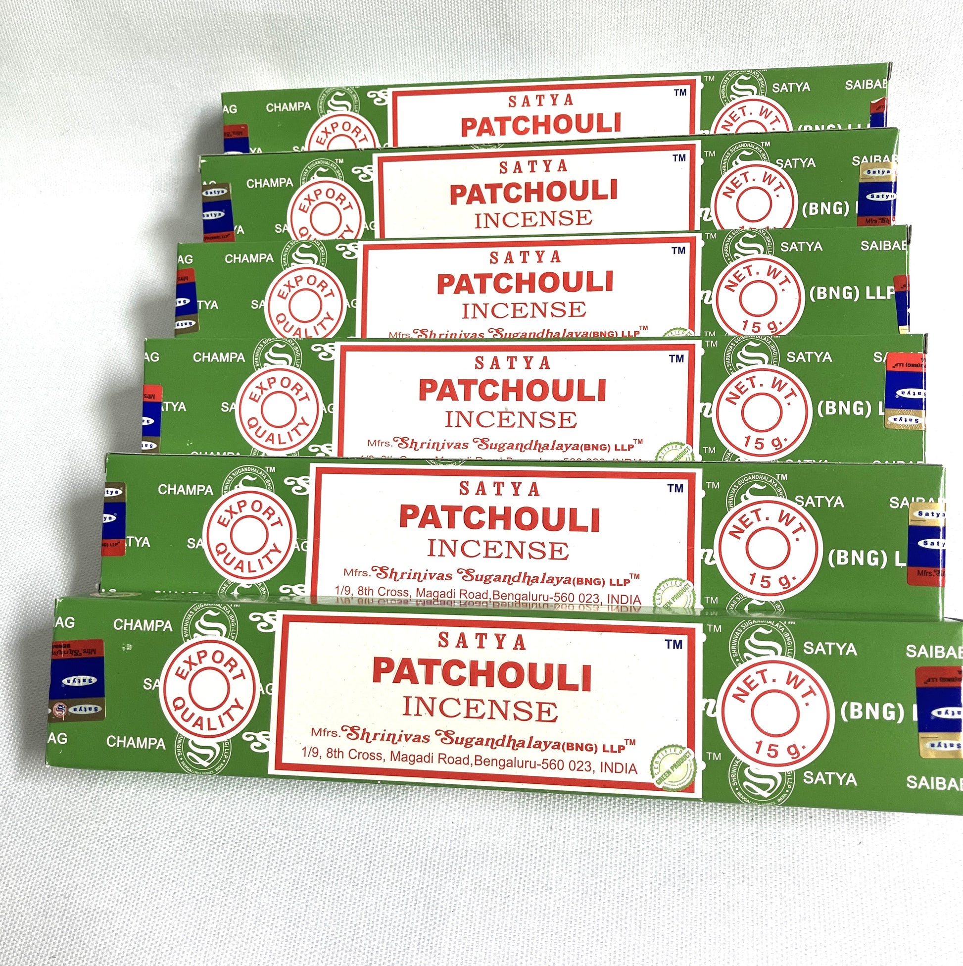 Multiple packages of Satya Patchouli Incense on a white background