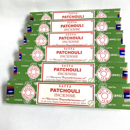 Multiple packages of Satya Patchouli Incense on a white background