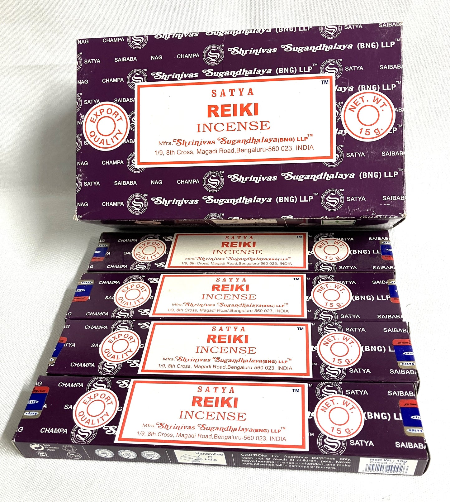 Multiple boxes of Satya Reiki Incense stacked on a white background