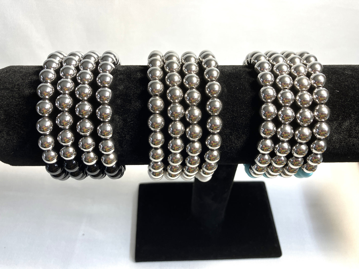 Natural stone bracelet showing bead detail and stainless steel accents