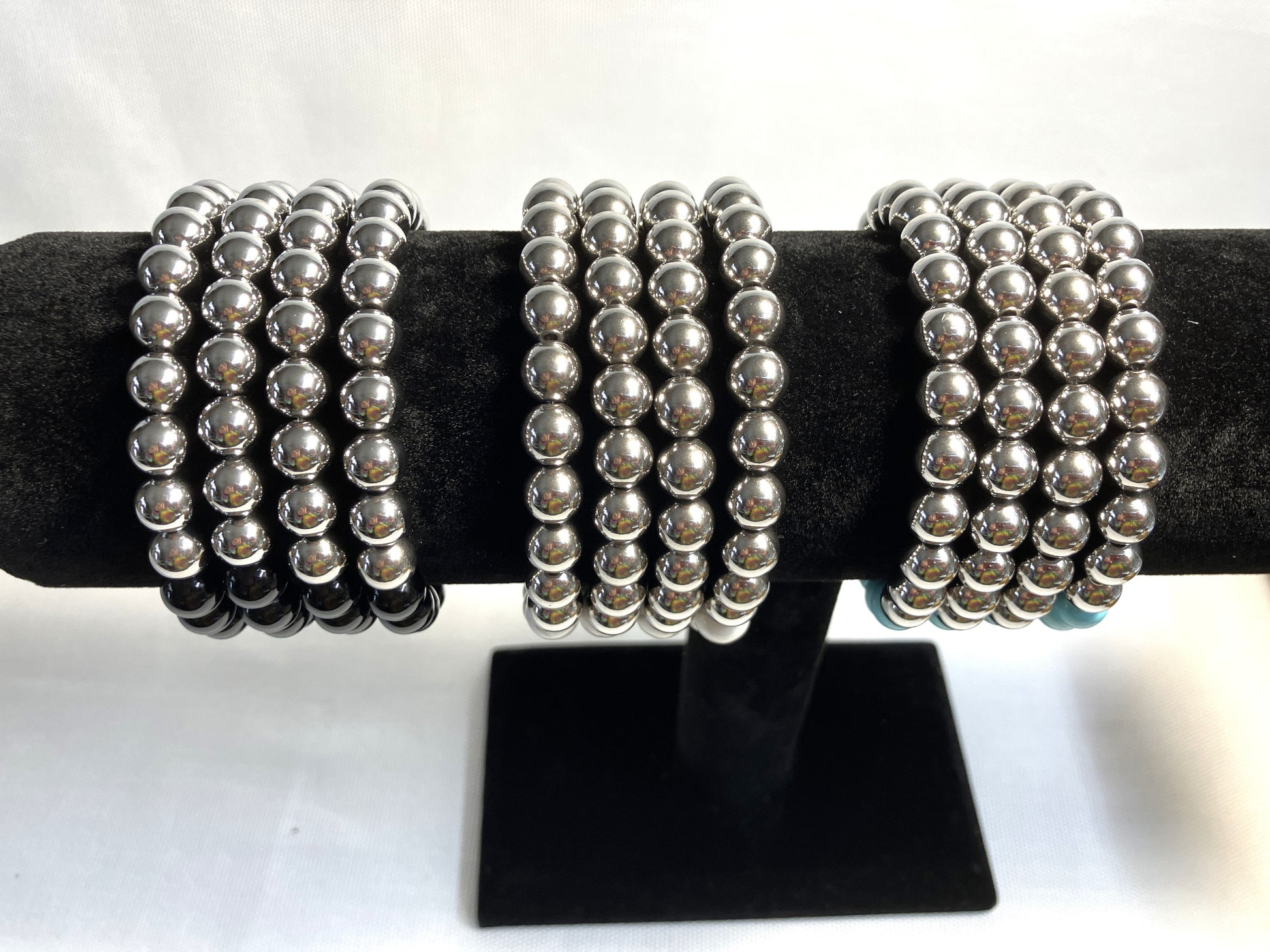 Natural stone bracelet showing bead detail and stainless steel accents