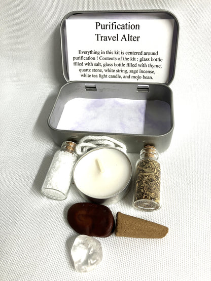 Purification Travel Alter kit with candle, bottles, and stones on a light background