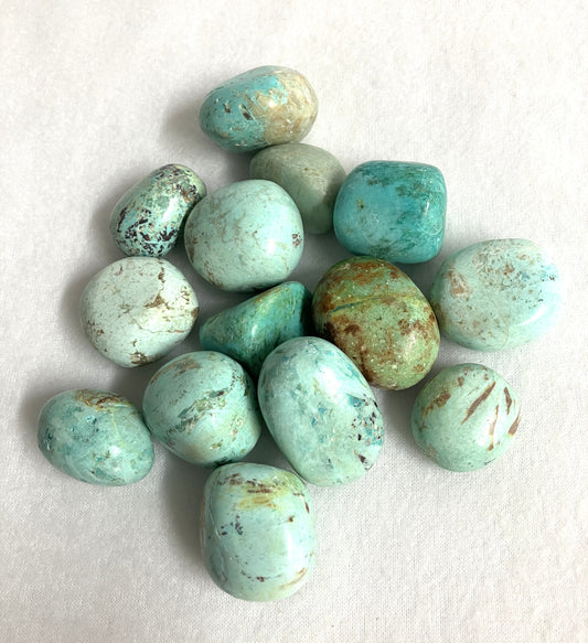 Turquoise Tumbled Crystals from Peru on a white background
