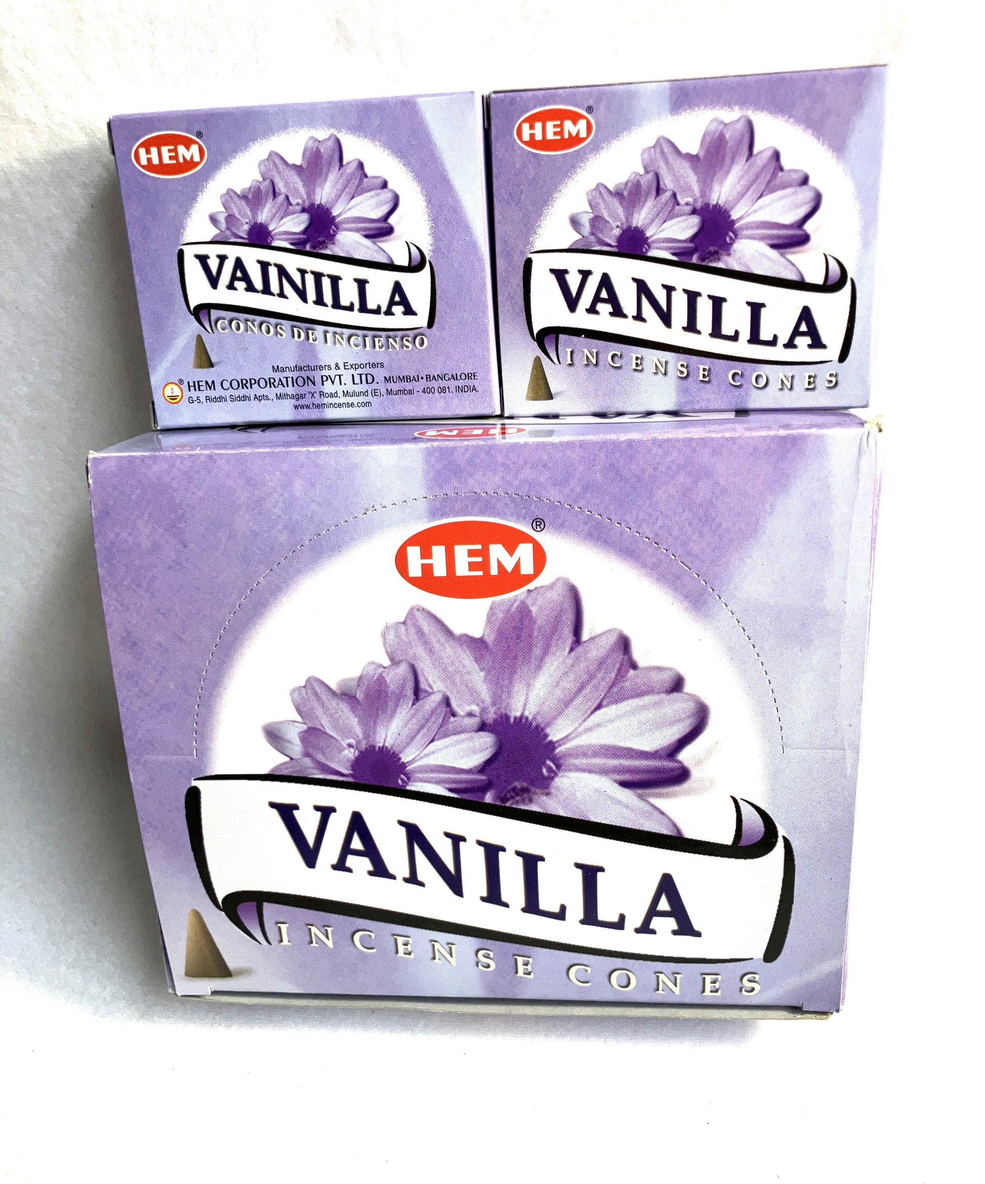 Master carton and two boxes of HEM Vanilla Incense Cones shown on a white background