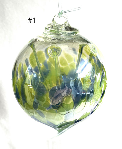 Blown Glass Witch Balls with green and blue patterns on a white background