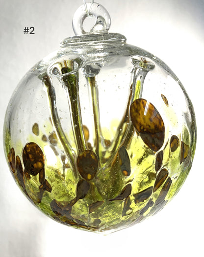Blown Glass Witch Balls with abstract design on a white background