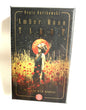 Amber Moon Tarot card set packaging with a woman in a field of flowers and a red moon.