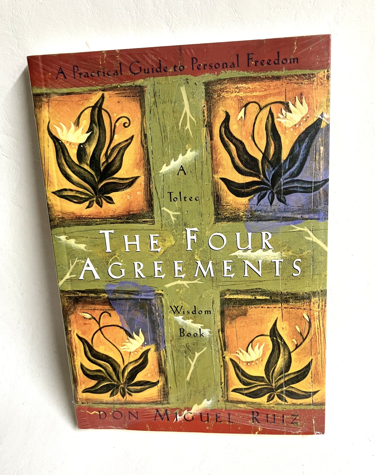 The Four Agreements by Don Miguel Ruiz book cover - personal growth and spiritual wisdom