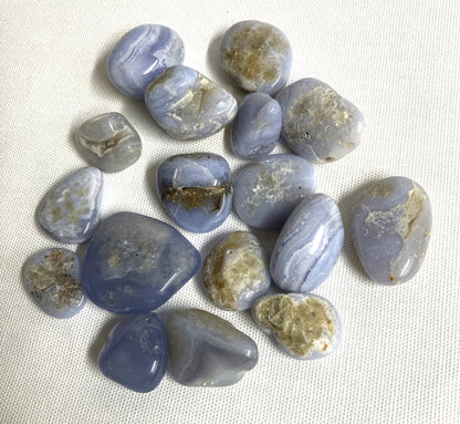 Back side of Blue Lace Agate Crystals on a white fabric background