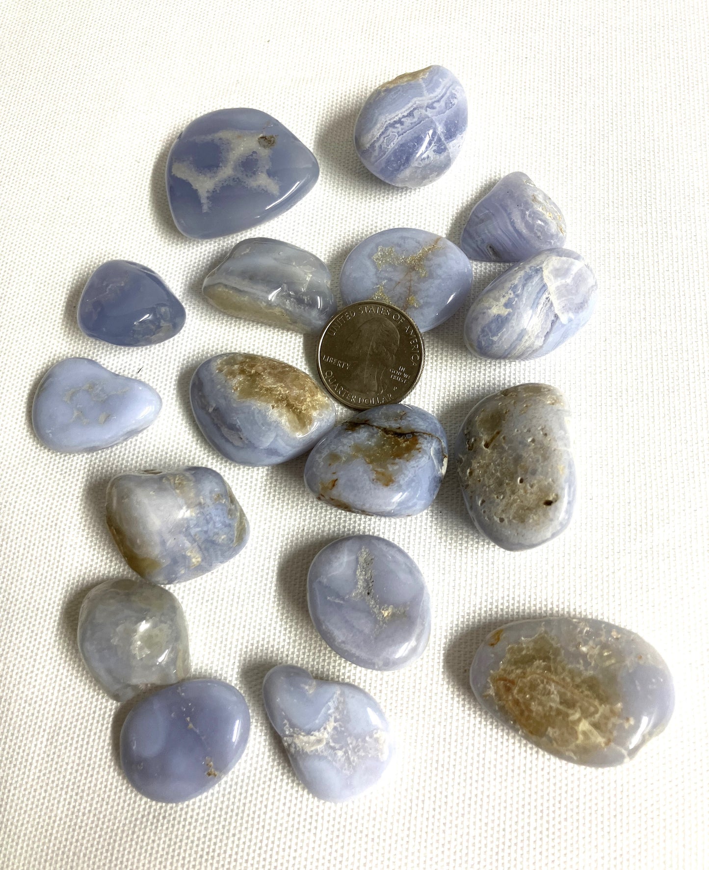 Blue Lace Agate Crystals showing the variations of pattern and color on a white background