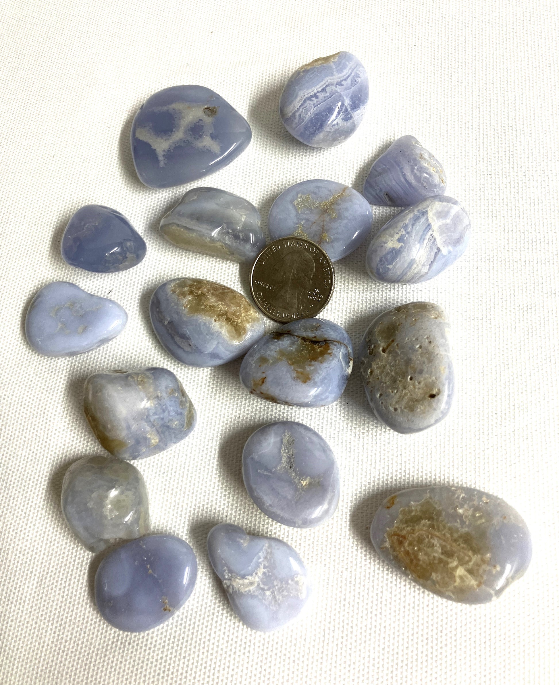 Blue Lace Agate Crystals showing the variations of pattern and color on a white background