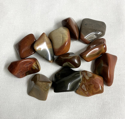 View 4 of Desert Jasper Crystal AKA Polychrome Jasper  on a textured white surface