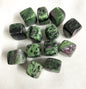 Top view of Ruby in Zoisite Crystals on a white fabric background