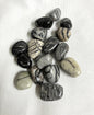 Front view of Spider Web Jasper Crystals on a white fabric background