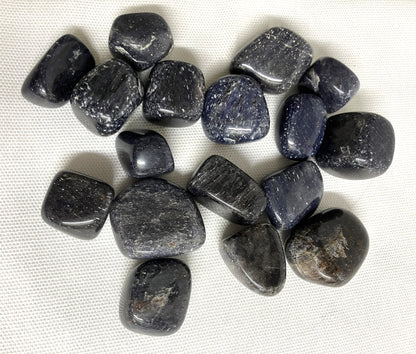 Bottom view of Blue Aventurine Tumbled Crystals on a white fabric background