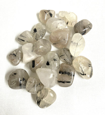Back side of Tourmalinated Quartz Crystals on a white background