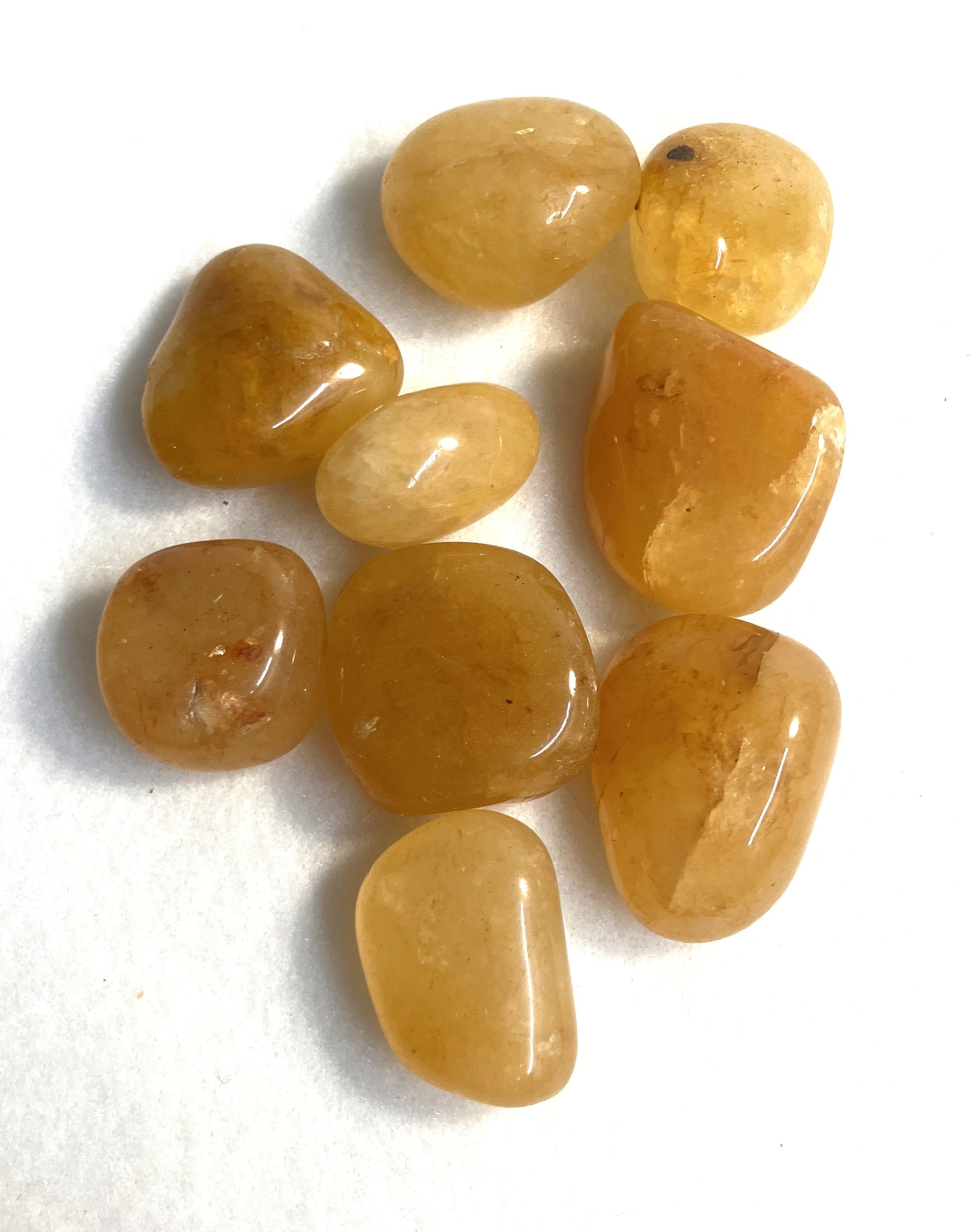 Group of Golden Azeztulite Crystals shown on a white background