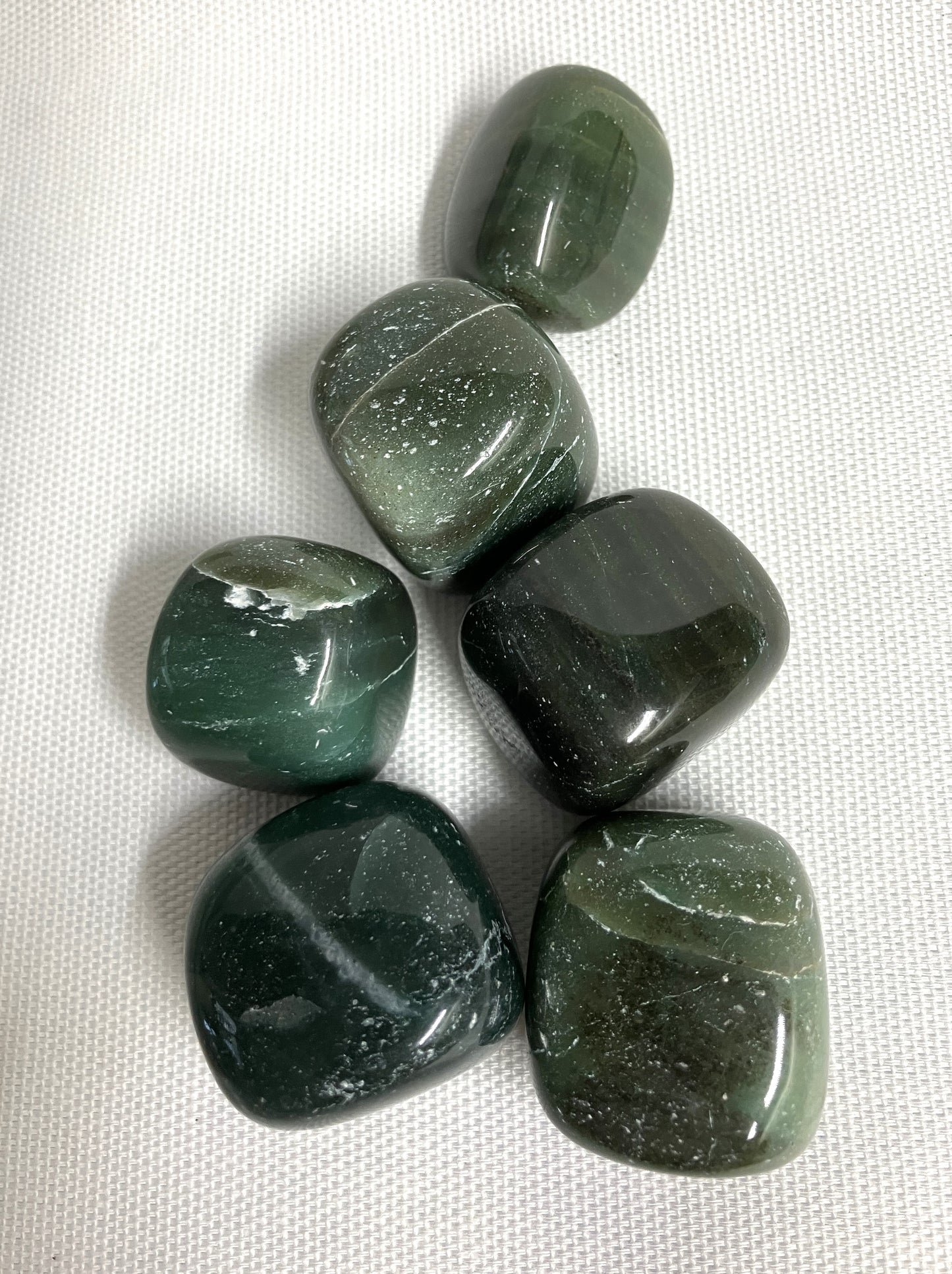 View of Bowenite displaying  an assortment of patterns  back side