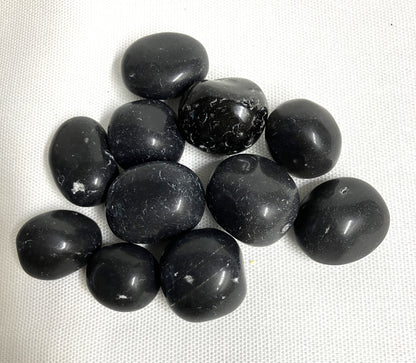 A closeup view of Black Agni Manitite Crystal aka Pearl of Fires showing details of the back. 