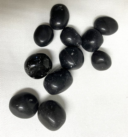 A group of assorted Black Agni Manitite Crystal aka Pearl of Fire showing a second side