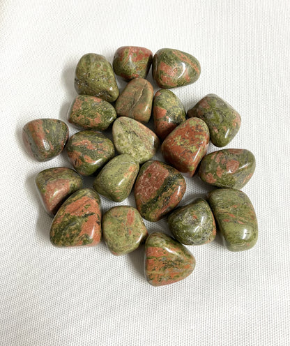 Closeup of Unakite Crystal on a white background