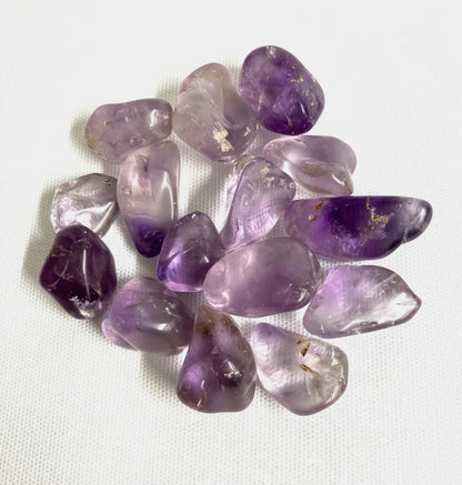 Another view of Amethyst Crystals on a white fabric background