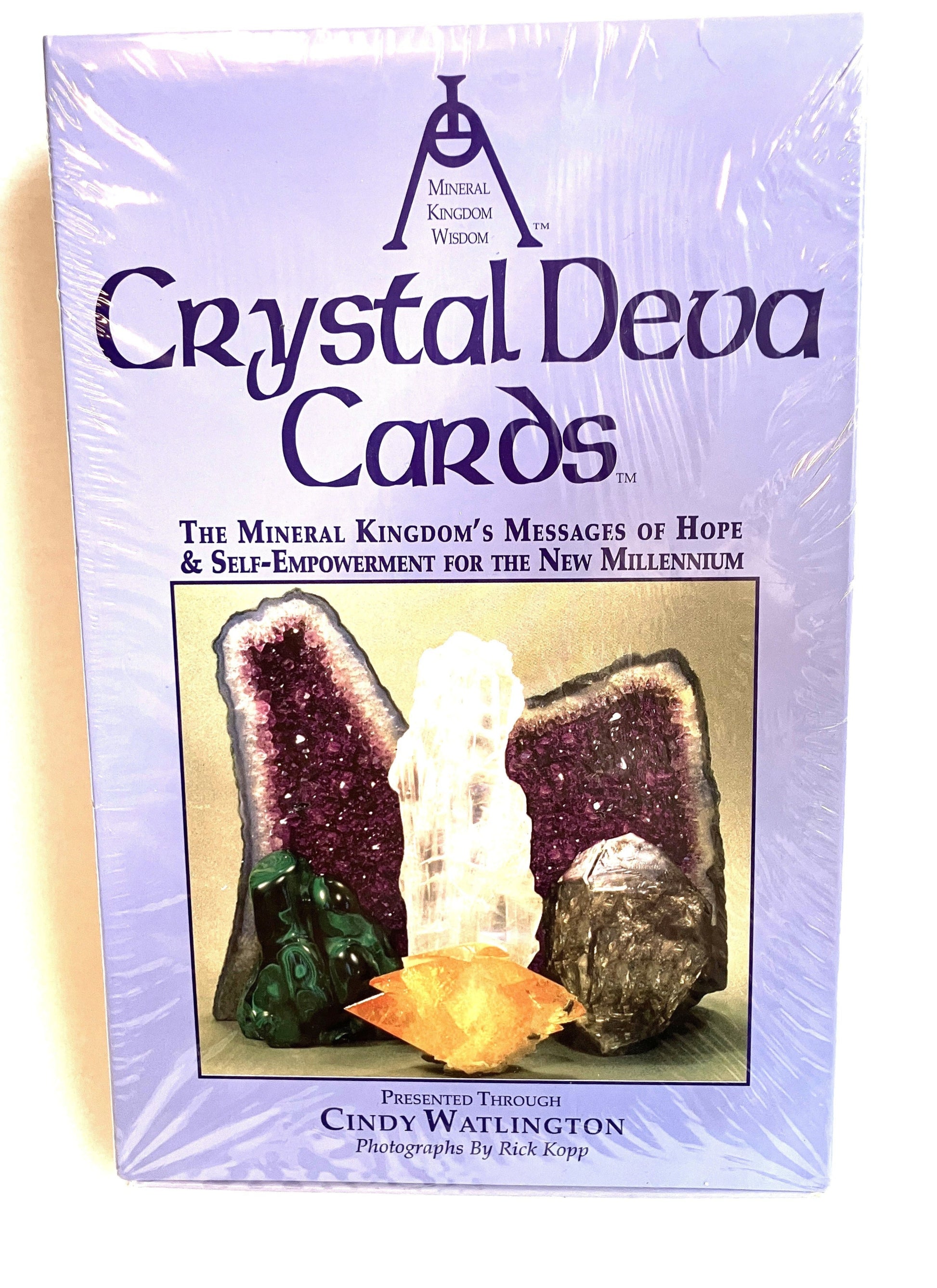 Packaging of Crystal Deva Cards with crystal imagery on a purple background