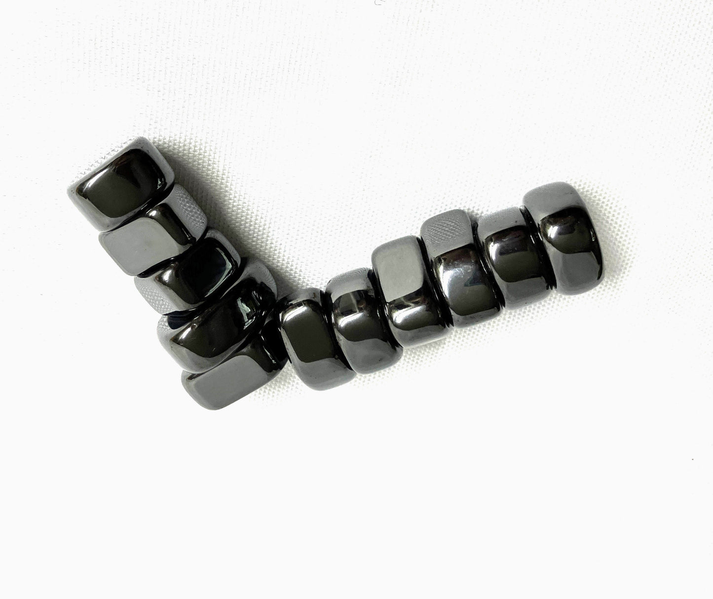 Magnetic Hematite Crystals shown  on a white background