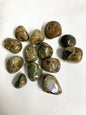 Collection of Rhyolite Crystals on a white fabric background