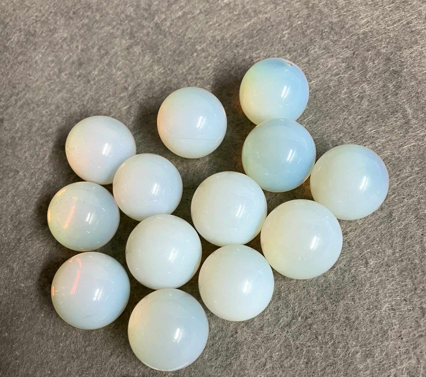 Closeup of Opalite Spheres on a gray surface