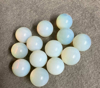 Closeup of Opalite Spheres on a gray surface