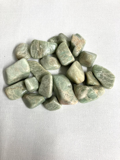 Back view of Amazonite Crystals on a white fabric background