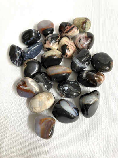 Back view of Black Sardonyx Crystals on a white fabric background