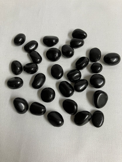 Front view of Shungite Crystals  on a light gray background