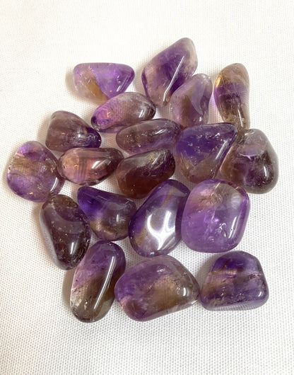 Collection of Ametrine Tumbled  Crystals on a white background