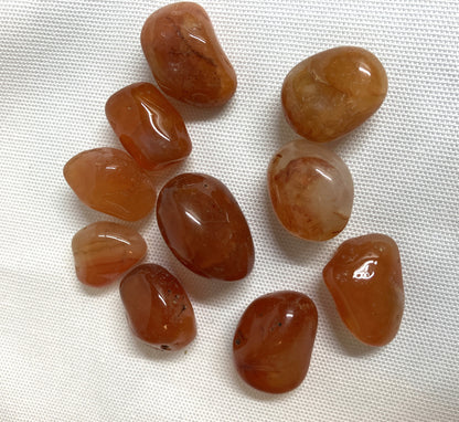 Carnelian Crystals on a white fabric background