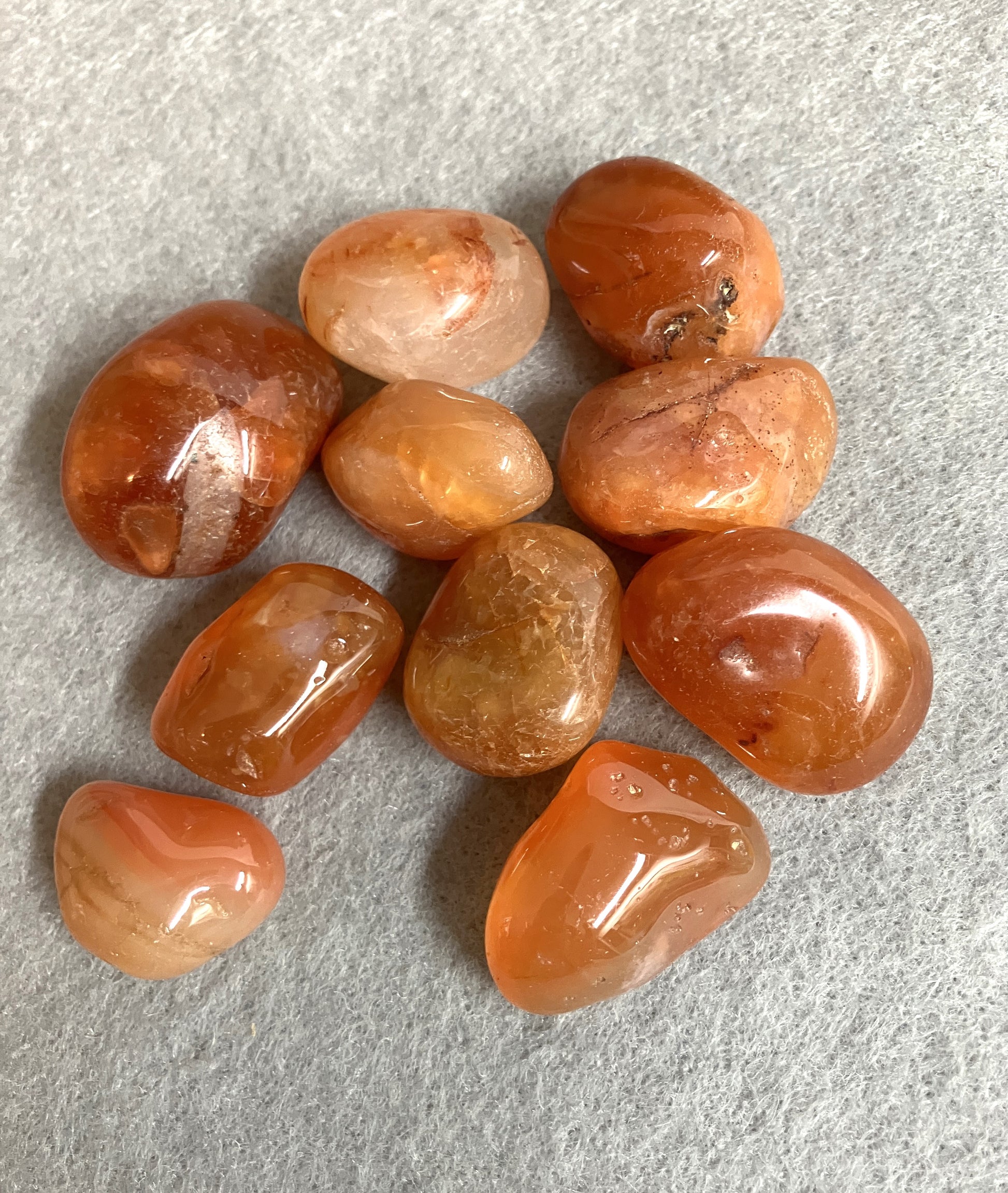 Closeup of Carnelian Crystals back side on a gray surface