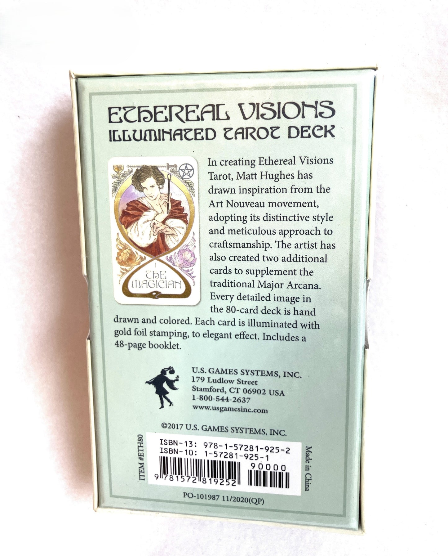 Back of a Tarot card box titled 'Ethereal Visions Illuminated Tarot Deck' with text and a barcode.