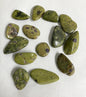Group of Stichtite with Serpentine Crystals AKA Alantistie on a white fabric background