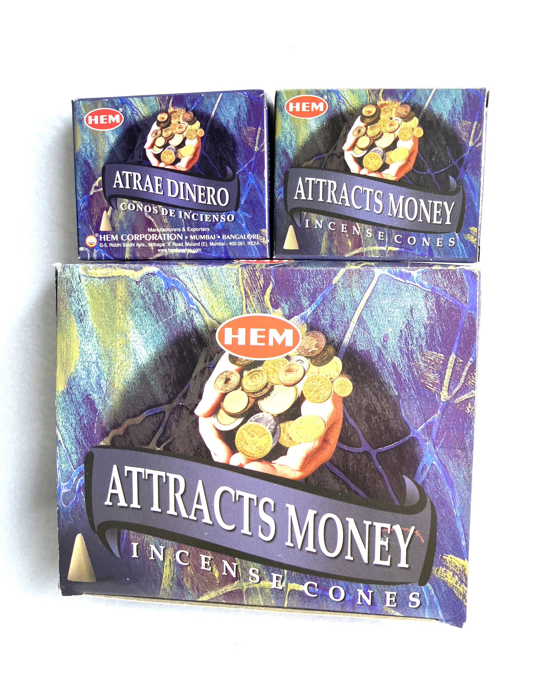 Master carton and two boxes of HEM Incense Cones labeled 'Attracts Money shown on a white background