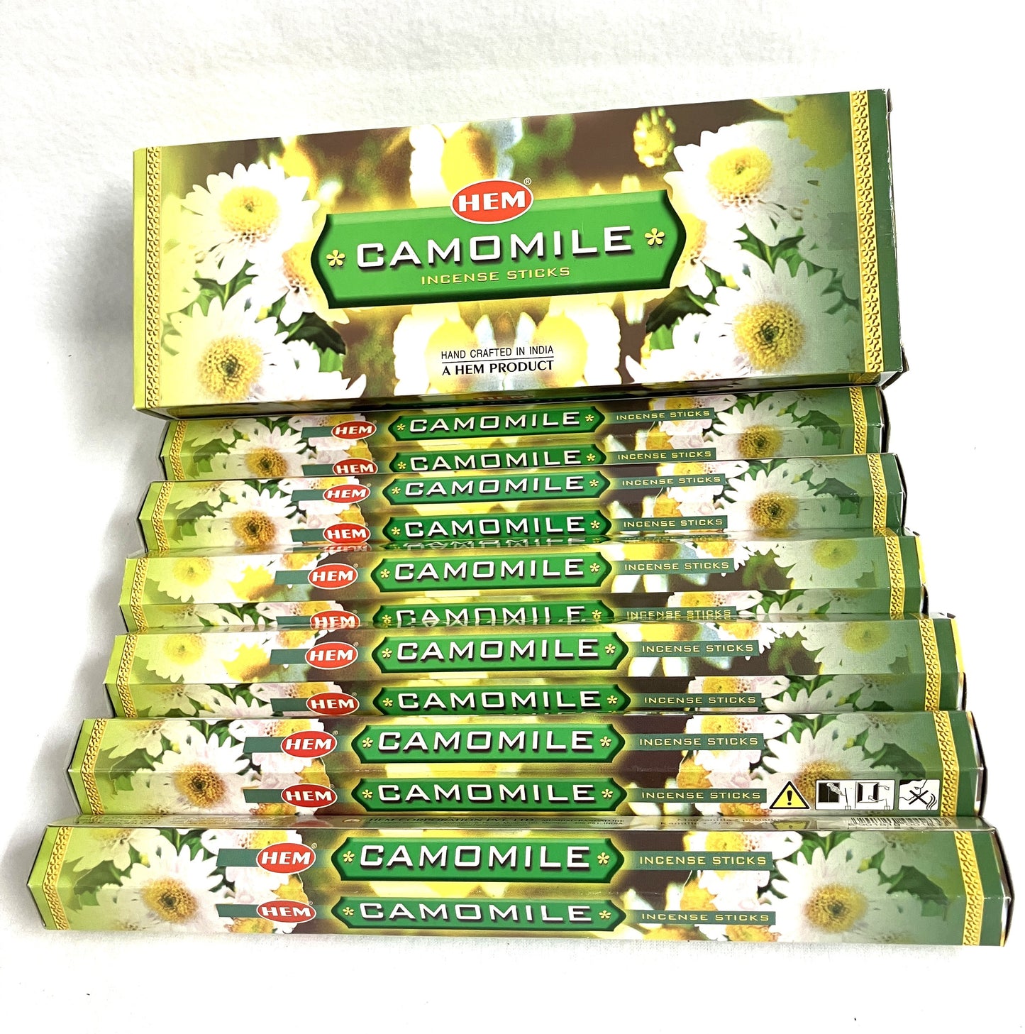 Box of HEM Camomile incense sticks with multiple boxes stacked below on a white background
